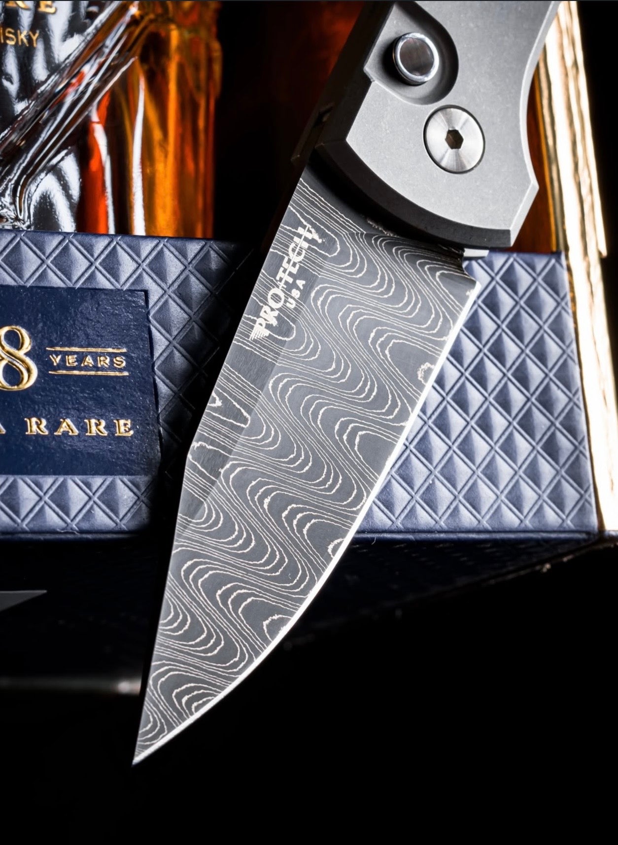 Pro-Tech Custom Scapegoat (2026 Scapegoat Compact Custom 004) Blade Show Texas 2026 Exclusive Scapegoat Auto - Blasted & Stonewashed 17-4 Handles - Vegas Forge Ladder Damascus Blade - Black Lip Pearl Button - Blue Anodized Ti Short Deep Carry Clip